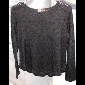 A dark grey long sleeve tee.